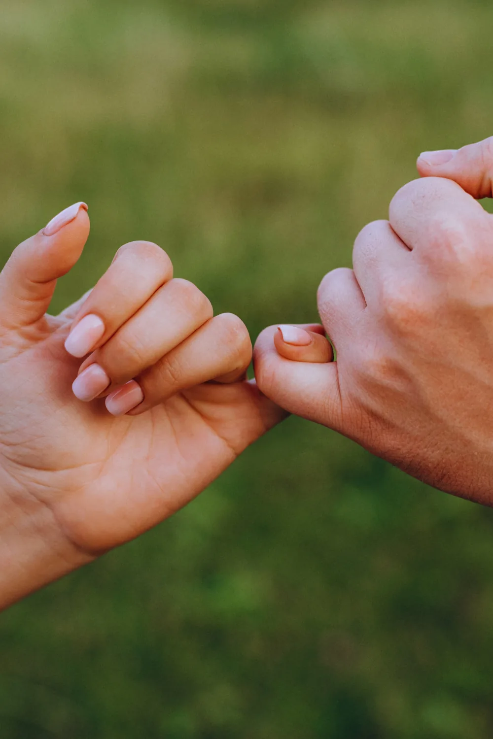 Two people bumping fists, from the Boss Mortgage image library